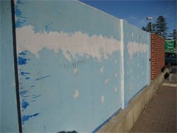 This blue board fence was not properly flushed